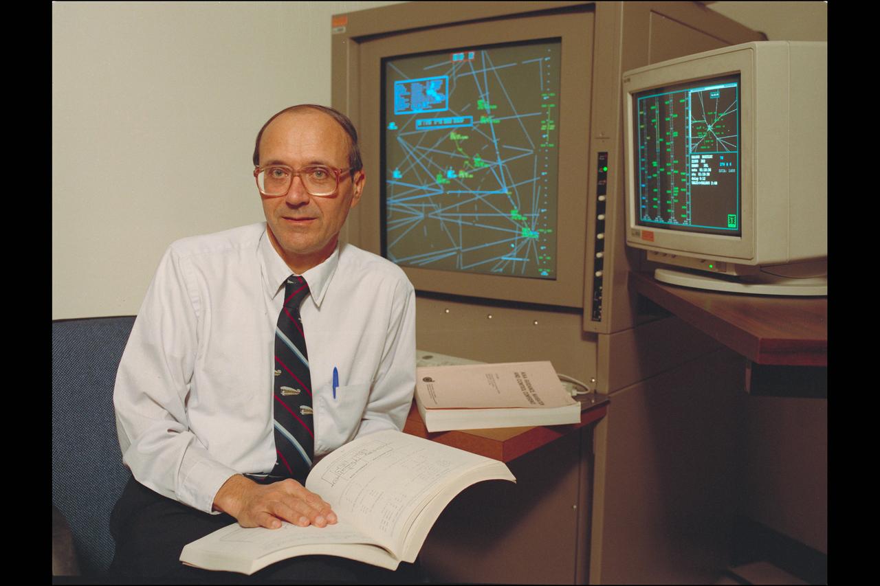 Dr Heinz Erzberger, Ames Fellow (1999) in the Air Traffic Control (ATC).  Dr Erzberger displays the complicated algorithms he devised as part of Ames' work to improve air traffic safety.