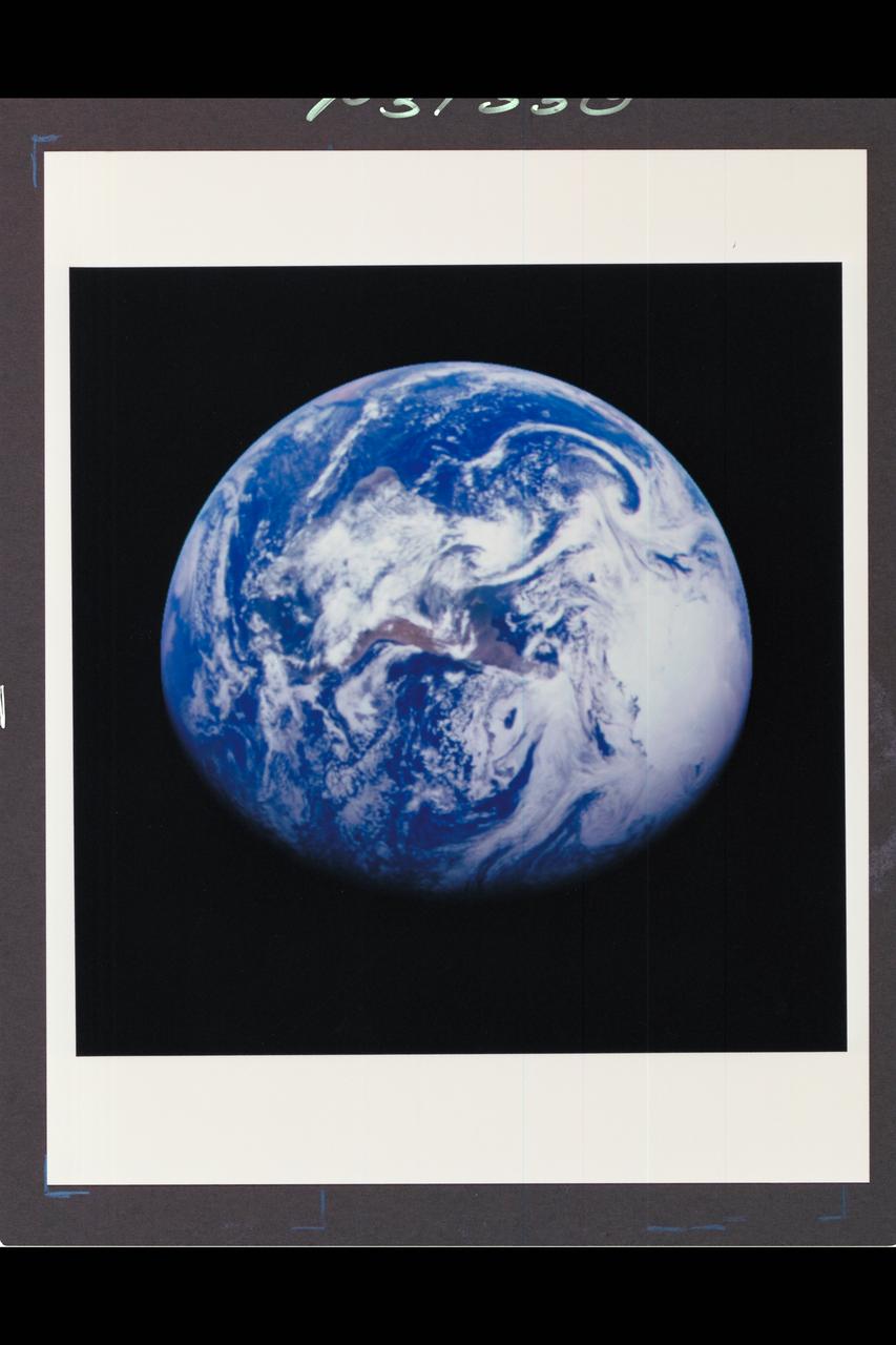 ref # P-37330 Range :  1.3 million miles This color image of the Earth was obtained by the Galileo spacecraft at about 6:10 am PST.  The color composite used images taken through the red, green and violet filters.  South America is near the center of the picture, and the white, sunlit continent of Antarctica is below.  Picturesque weather fronts are visible in the South Atlantic, lower right.  This is the first frame of the Galileo Earth spin movie, a 500-frame time-lapse motion picture showing a 25-hour period of Earth's rotation and atmosphertic dynamics.