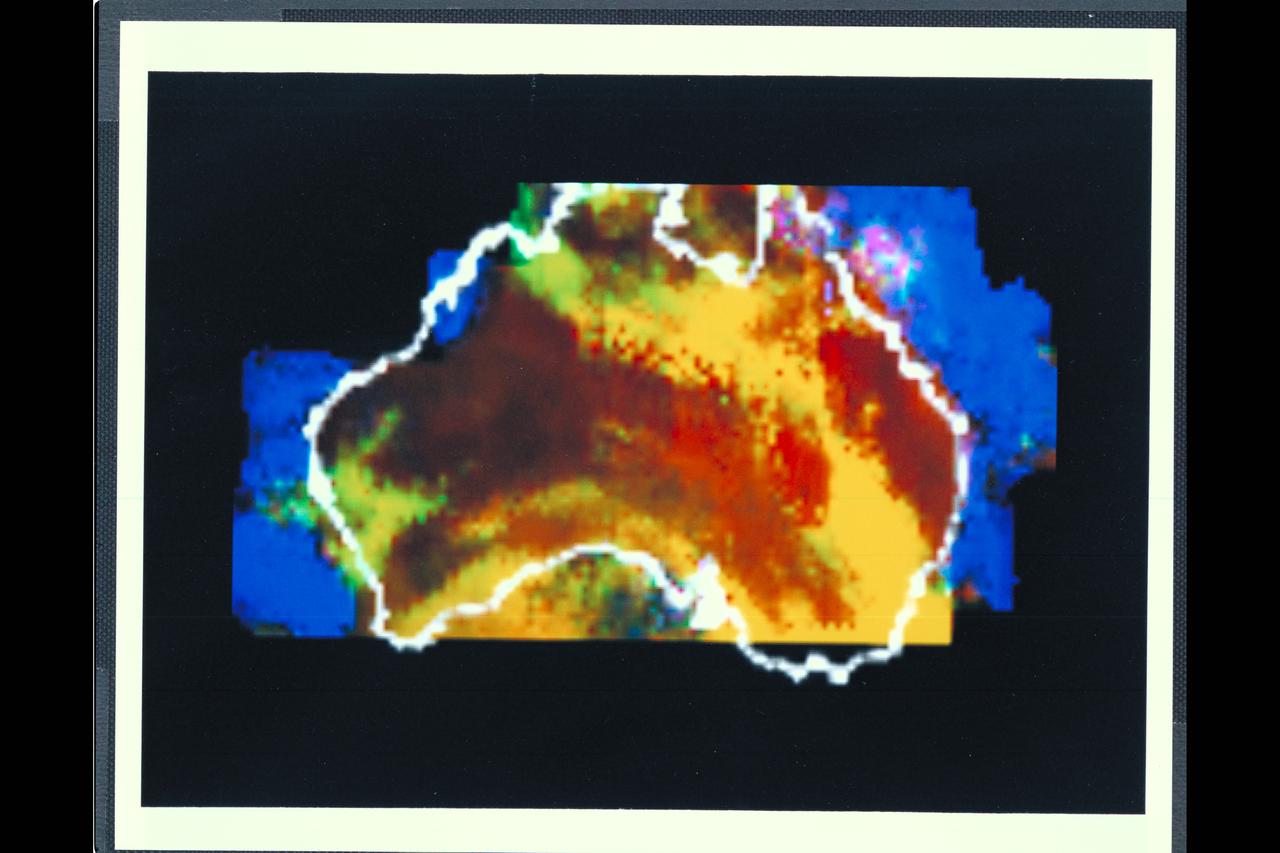 Range : 50,000 miles This multispectral map of Australia, and surrounding seas was obtained by the Galileo spacecraft's Near Infrared Mapping Spectrometer shortly after closest approach. The image shows various ocean, land and atmospheric cloud features as they appear in three of the 408 infrared colors or wavelengths sensed by the instrument. The wavelength of 0.873 micron, represented as blue in the photo, shows regions of enhanced liquid water absorption, i.e. the Pacific and Indian oceans. The 0.984-micron band, represented as red, shows areas of enhanced ground reflection as on the Australian continent. This wavelength is also s ensitive to the reflectivity of relatively thick clouds. The 0.939-micron wavelength, shown as green, is a strong water-vapor-absorbing band, and is used to accentuate clouds lying above the strongly absorbing lower atmosphere. When mixed with the red indicator of cloud reflection, the green produces a yellowish hue; this indicates thick clouds. The distinctive purplish color off the northeast coast marks the unusually shallow waters of the Great Barrier Reef and the Coral Sea. Here the blue denoting water absorption combines with the red denoting reflection from coral and surface marine organisms to produce thiss unusual color. The Near Infrared Mapping Spectrometer (NIMS) on the Galileo spacecraft is a combines mapping (imaging) and spectral instrument. It can sense 408 contiguous wavelengths from 0.7 micron (deep red) to 5.2 microns, and can construct a map or image by mechanical scanning. It can spectroscopically analyze atmospheres and surfaces and construct thermal and chemical maps.