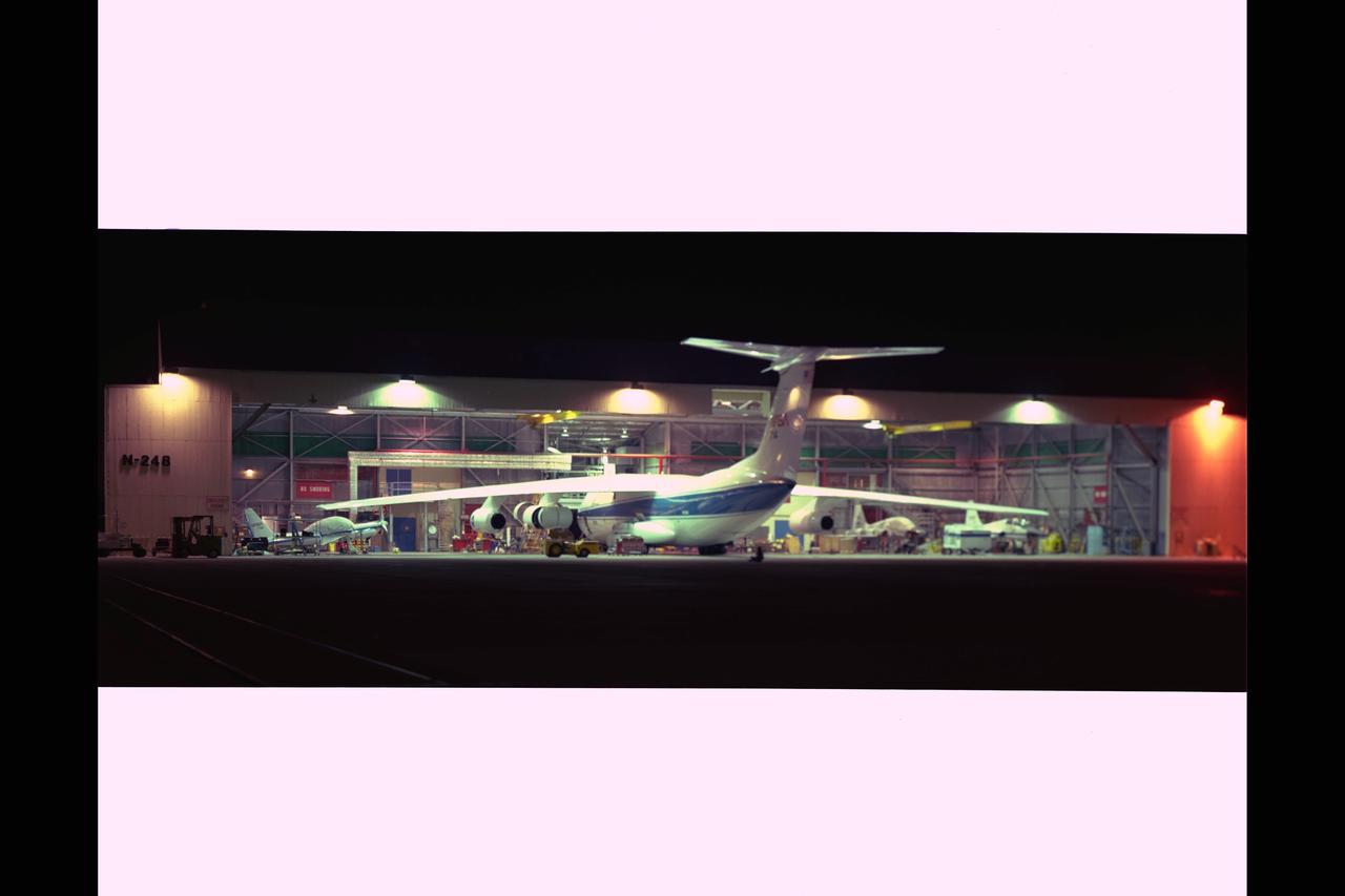NASA Ames Research Center interaction with environment. This evening shot was timed exposed in front of the Aircraft Servicing Facility (N-248) with C-141 (NASA-714) in for service.