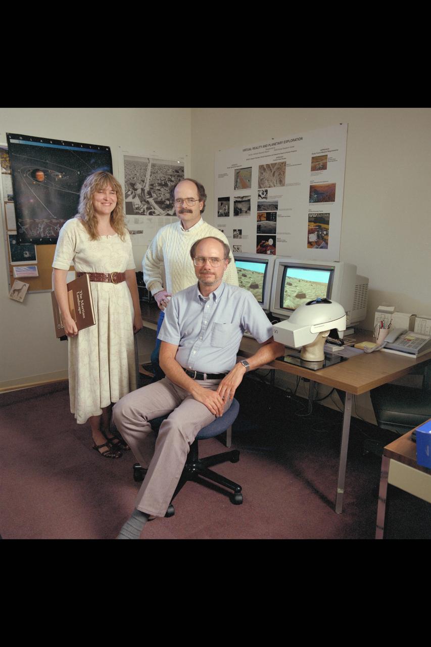Virtual Environment Telepresence workstation, simulated Mars Exploration group: Lewis Hitchner, (seated) Cindy Fergouson, & Dr Michael McGreevy (standing)