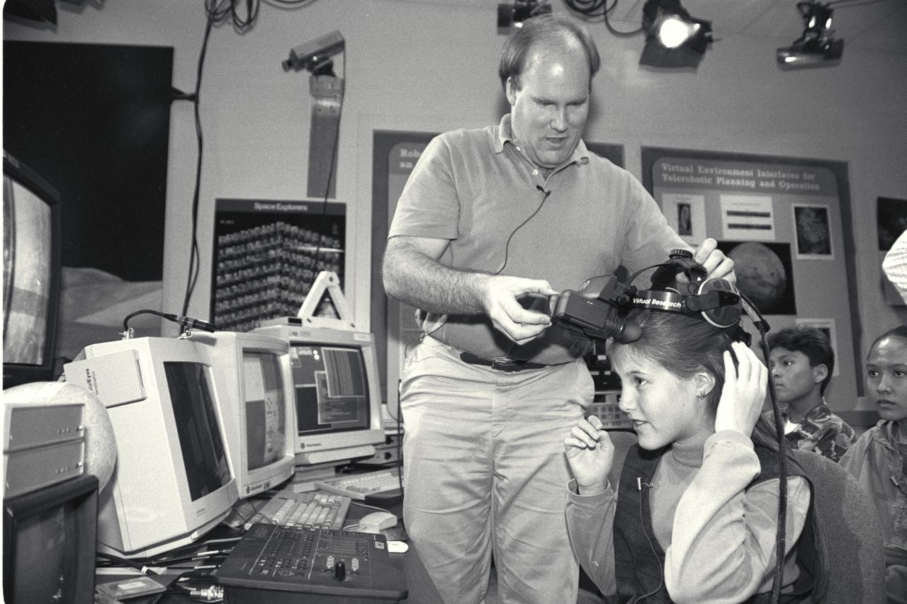 'Life from other Worlds' with McNair Middle School TROV robot explores under Antarctic ice - image during demo Ames reseacher Bob Hine leads students operating TROV