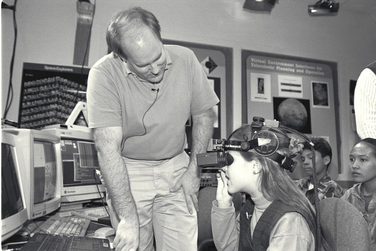 'Life from other Worlds' with McNair Middle School TROV robot explores under Antarctic ice - image during demo Ames reseacher Bob Hine leads students operating TROV