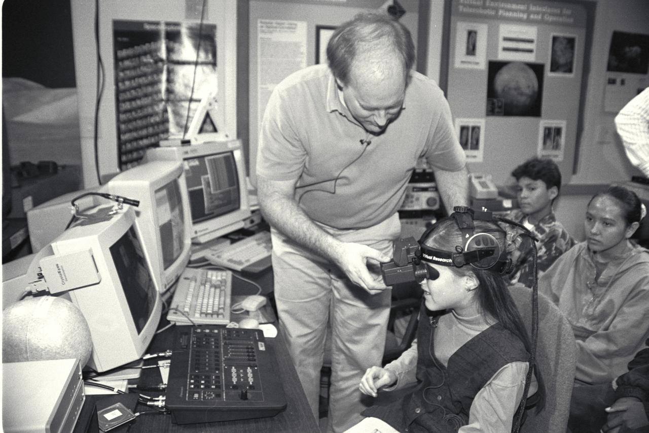 'Life from other Worlds' with McNair Middle School TROV robot explores under Antarctic ice - image during demo Ames reseacher Bob Hine leads students operating TROV