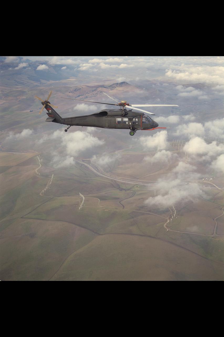 UH-60B (NASA-748) Blackhawk helicopter with MUX-Bucket in flight