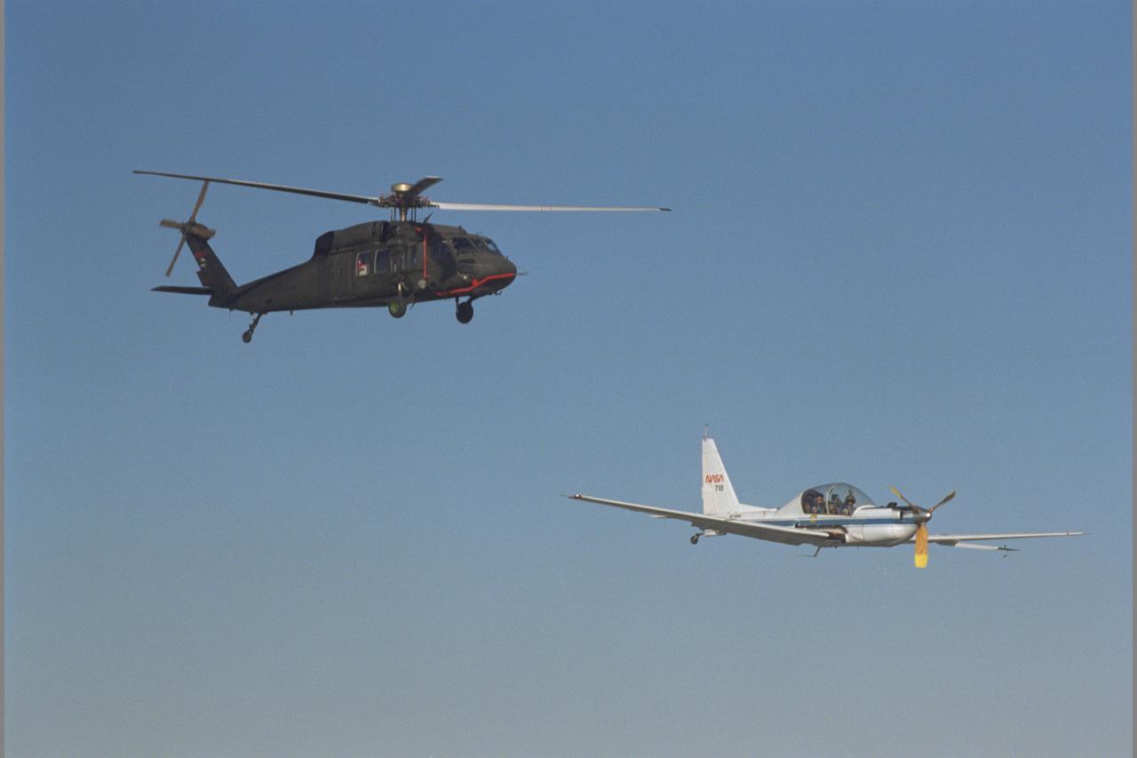 UH-60 Blackhawk (NASA 748) and YO-3A (NASA-718) inflight over Altamont Pass, CA - Blade Vortex Interaction Noise experiment
