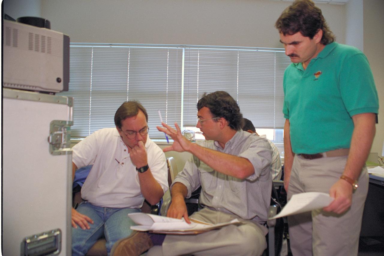 Life from other Worlds' with McNair Middle School TROV robot explores under Antarctic ice - image of Eric James, Ron Schutz, and Wade Sisler of the Photographic Technology Branch co-ordinating remote shots from Antarctic to Ames