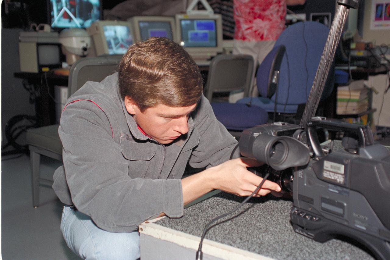 Life from other Worlds' with McNair Middle School TROV robot explores under Antarctic ice - images show Ken Saba during video set up