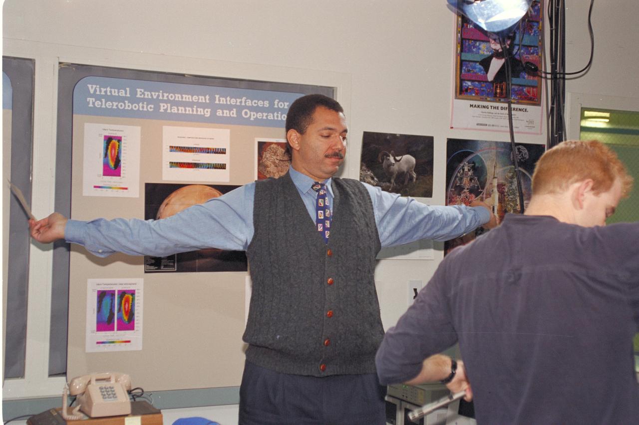 'Life from other Worlds' with McNair Middle School TROV robot explores under Antarctic ice - image shows Don James and Jay Schiebe during video setup.