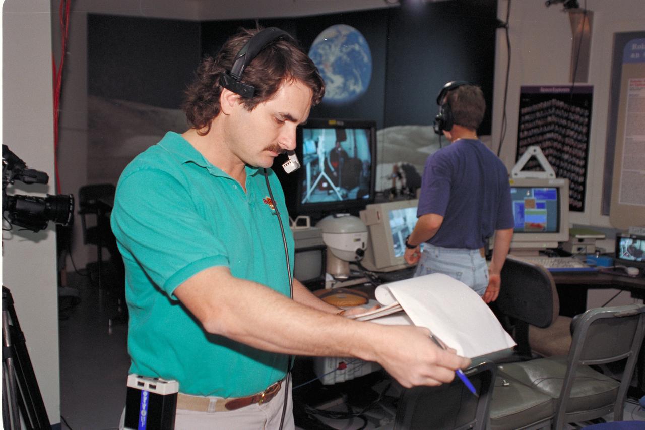 'Life from other Worlds' with McNair Middle School TROV robot explores under Antarctic ice - image shows Eric James during video setup