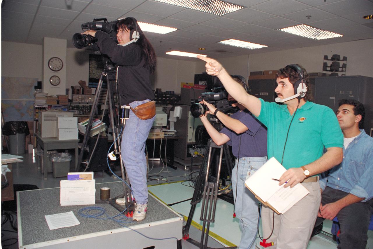 'Life from other Worlds' with McNair Middle School TROV robot explores under Antarctic ice - image shows Eric James and Michelle Bowers video taping