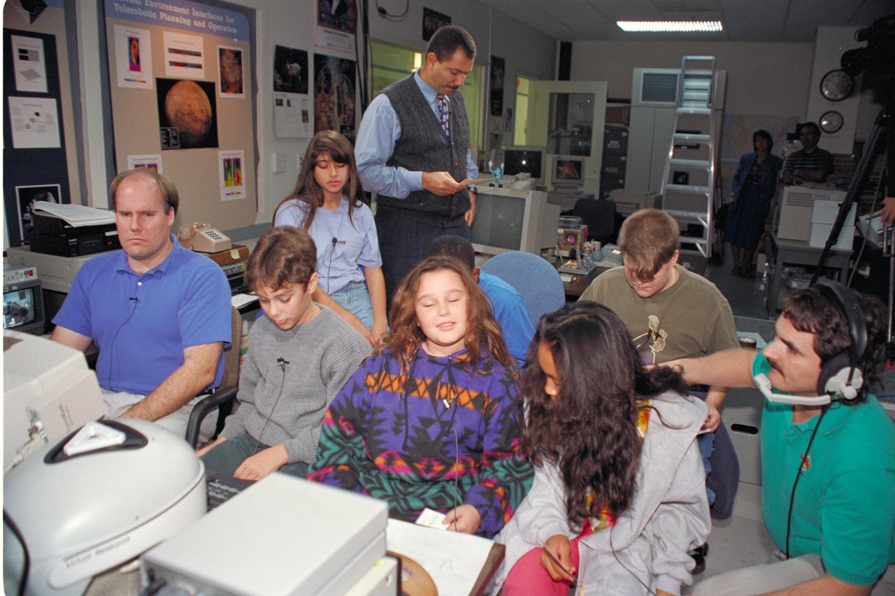 'Life from other Worlds' with McNair Middle School TROV robot explores under Antarctic ice - image during demo with students, Don James and Bob Hines.