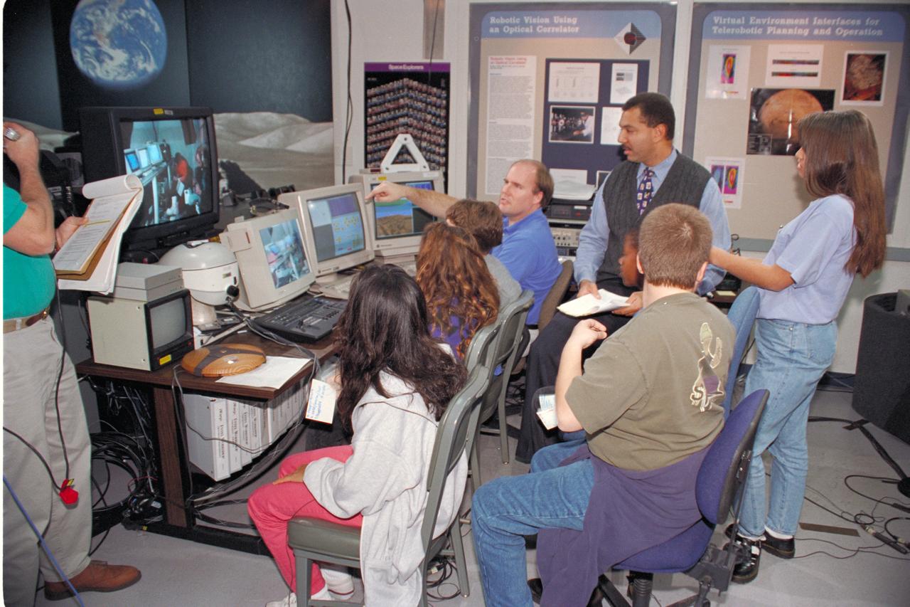 'Life from other Worlds' with McNair Middle School TROV robot explores under Antarctic ice - image during demo with students, Don James and Bob Hines.