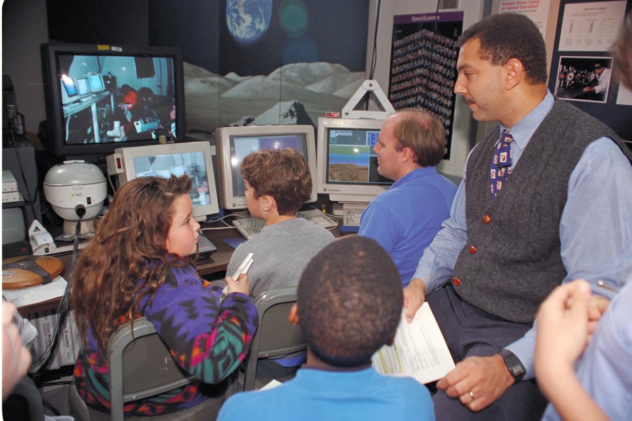 'Life from other Worlds' with McNair Middle School TROV robot explores under Antarctic ice - image during demo with students, Don James and Bob Hines.
