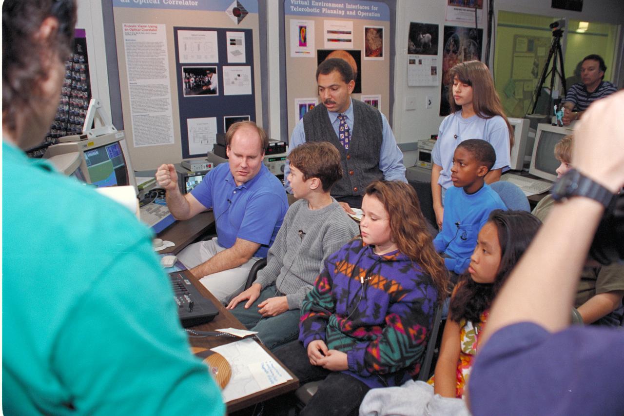 'Life from other Worlds' with McNair Middle School TROV robot explores under Antarctic ice - image during demo with students, Don James and Bob Hines.