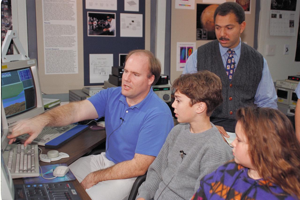 'Life from other Worlds' with McNair Middle School TROV robot explores under Antarctic ice - image during demo with students, Don James and Bob Hines.
