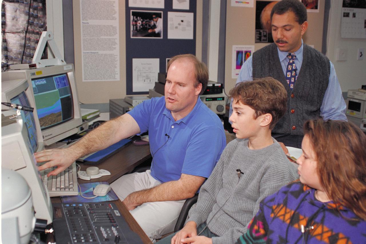 'Life from other Worlds' with McNair Middle School TROV robot explores under Antarctic ice - image during demo with students, Don James and Bob Hines.