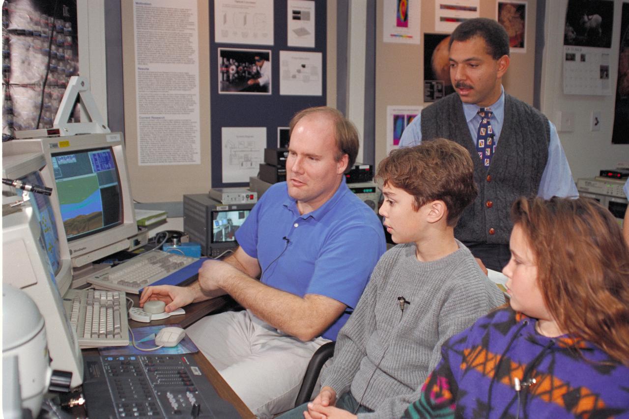 'Life from other Worlds' with McNair Middle School TROV robot explores under Antarctic ice - image during demo with students, Don James and Bob Hines.