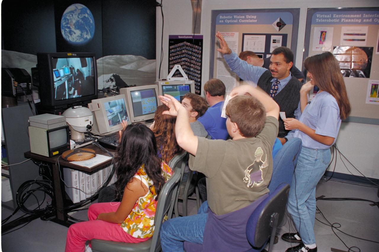 Life from other Worlds' with McNair Middle School TROV robot explores under Antarctic ice - image during demo with students, Don James and Bob Hines.