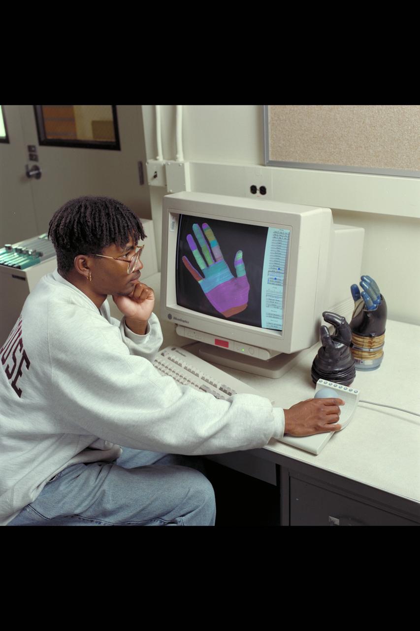 Ames Life Sciences Experiments: Cedi Snowden at Silicon Graphics with AX-5 spacesuit glove