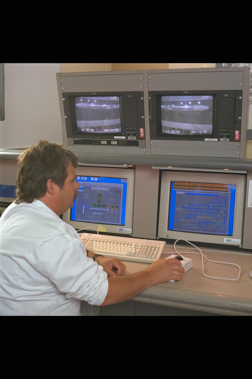 New renovated NASA Ames Research Center 12ft Pressure Wind Tunnel view of test section & mechanic with mobil command station, LB-435 model on RSS, lighting & viewing windows
