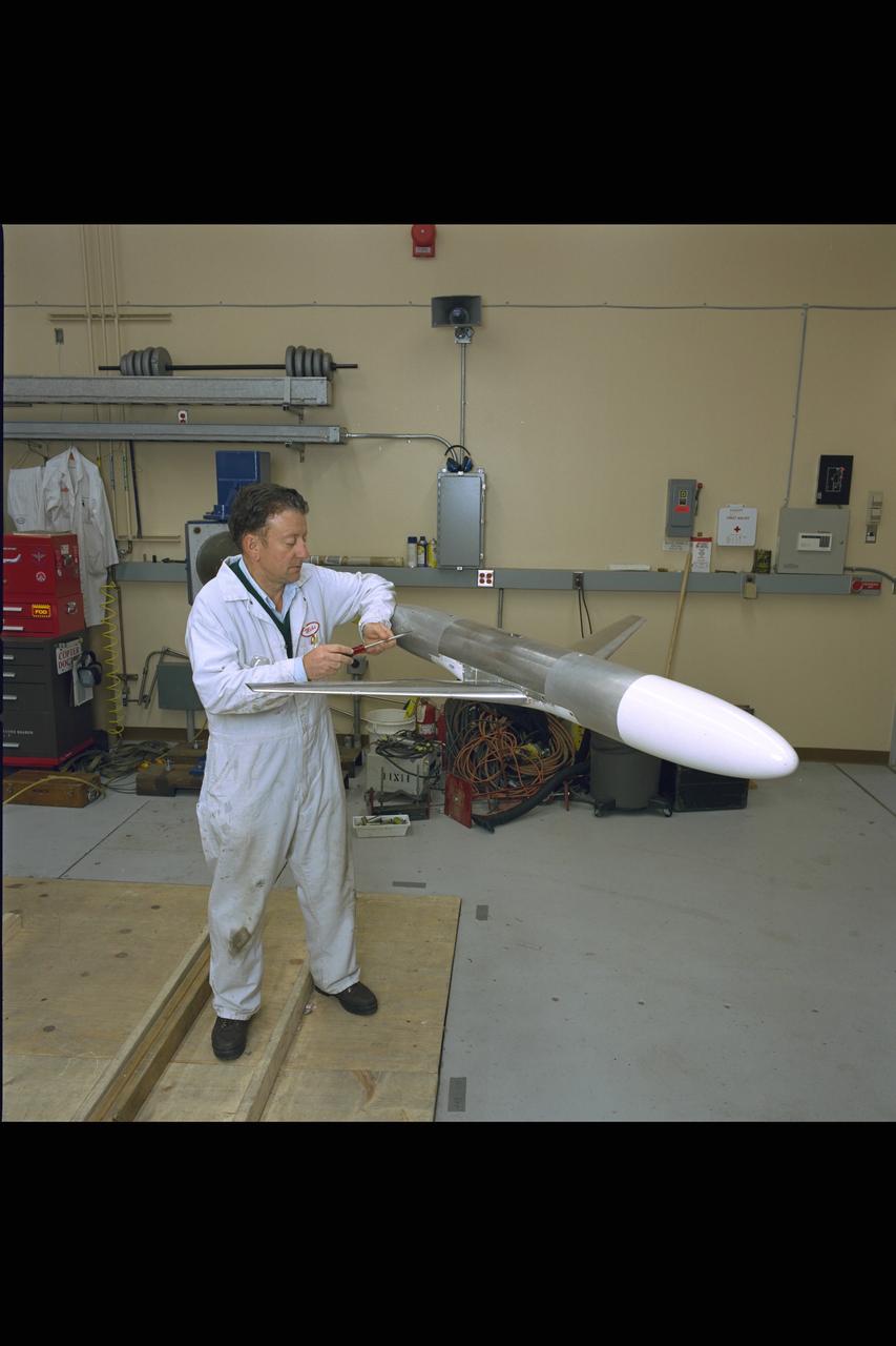 New renovated NASA Ames Research Center 12ft Pressure Wind Tunnel view of mechanic with mdoel in model prep area