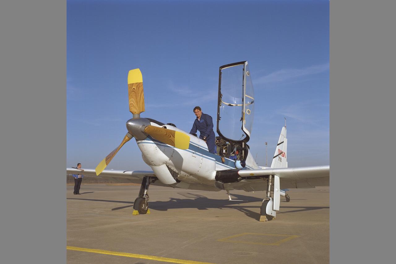 Megan McCluer in cockpit of YO-3A (NASA 718) during IRAP (inflight rotorcraft acoustics program) tests with XV-15 (NASA 703) over Bell Helicopter Textron Co.,