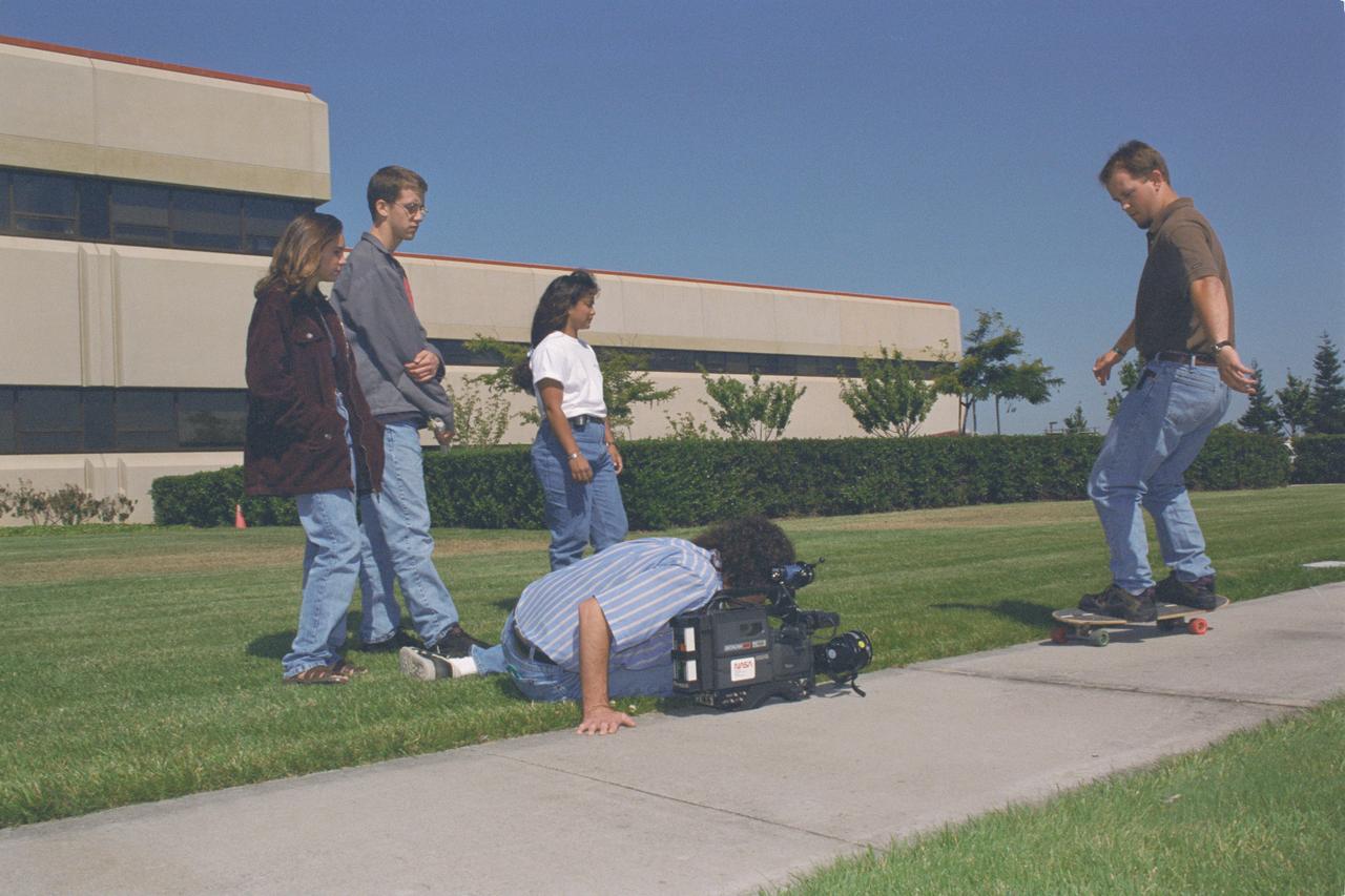 1996 MCP (Multimedia Curriculum Project) summer students practice techniques with Ames Documentation Technology Branch Video Groups' Patty Viajar and Adam Souza (photography student)
