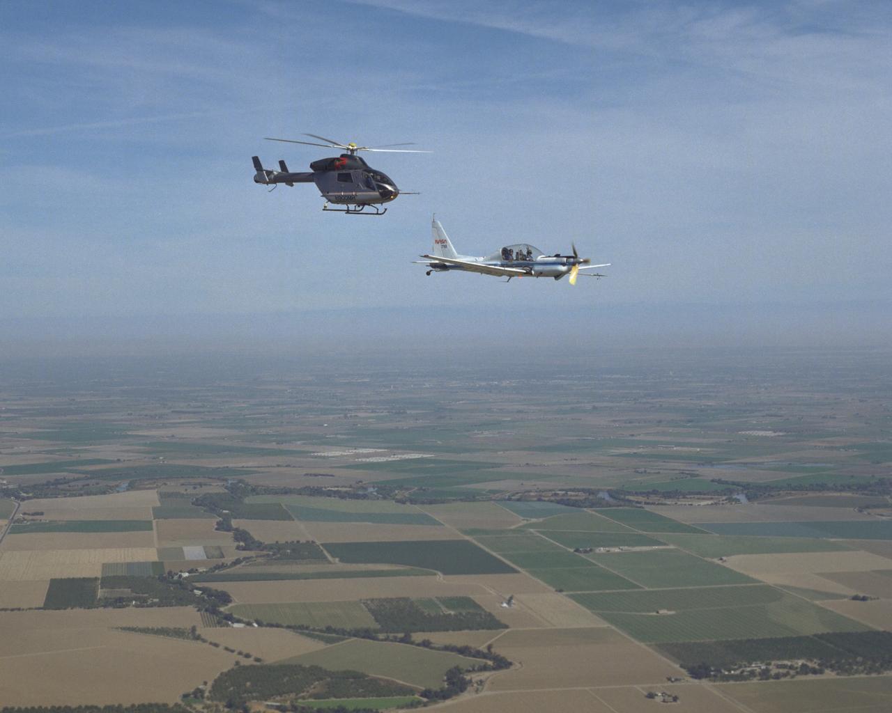 YO-3A (NASA-718) & MD-900 AIR TO AIR OVER MODESTO/CROWS LANDING.