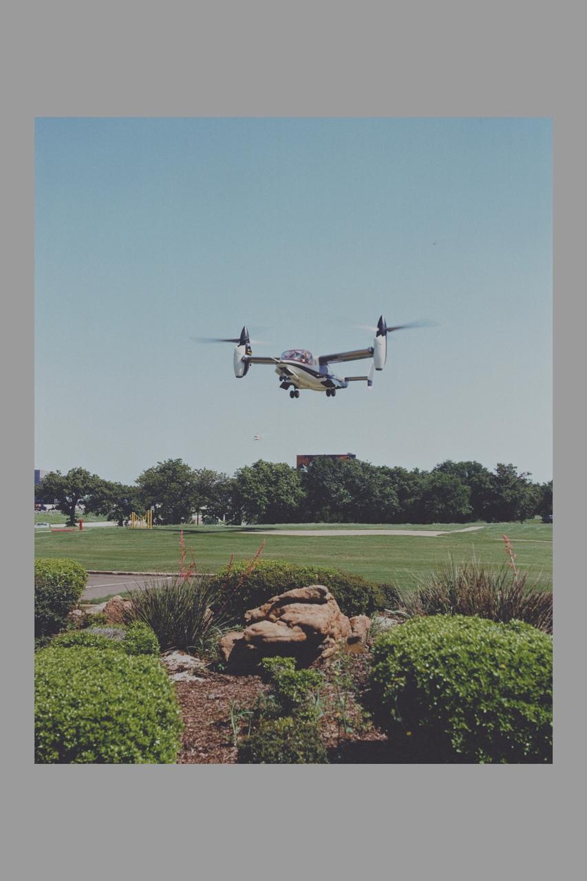 XV-15 Tiltrotor in hover helcipter flight at Bell Helicopter Co. Bell Photo number 043903 (credit and permission required from Bell Helicopter Company for any non-governmental  reproductions)