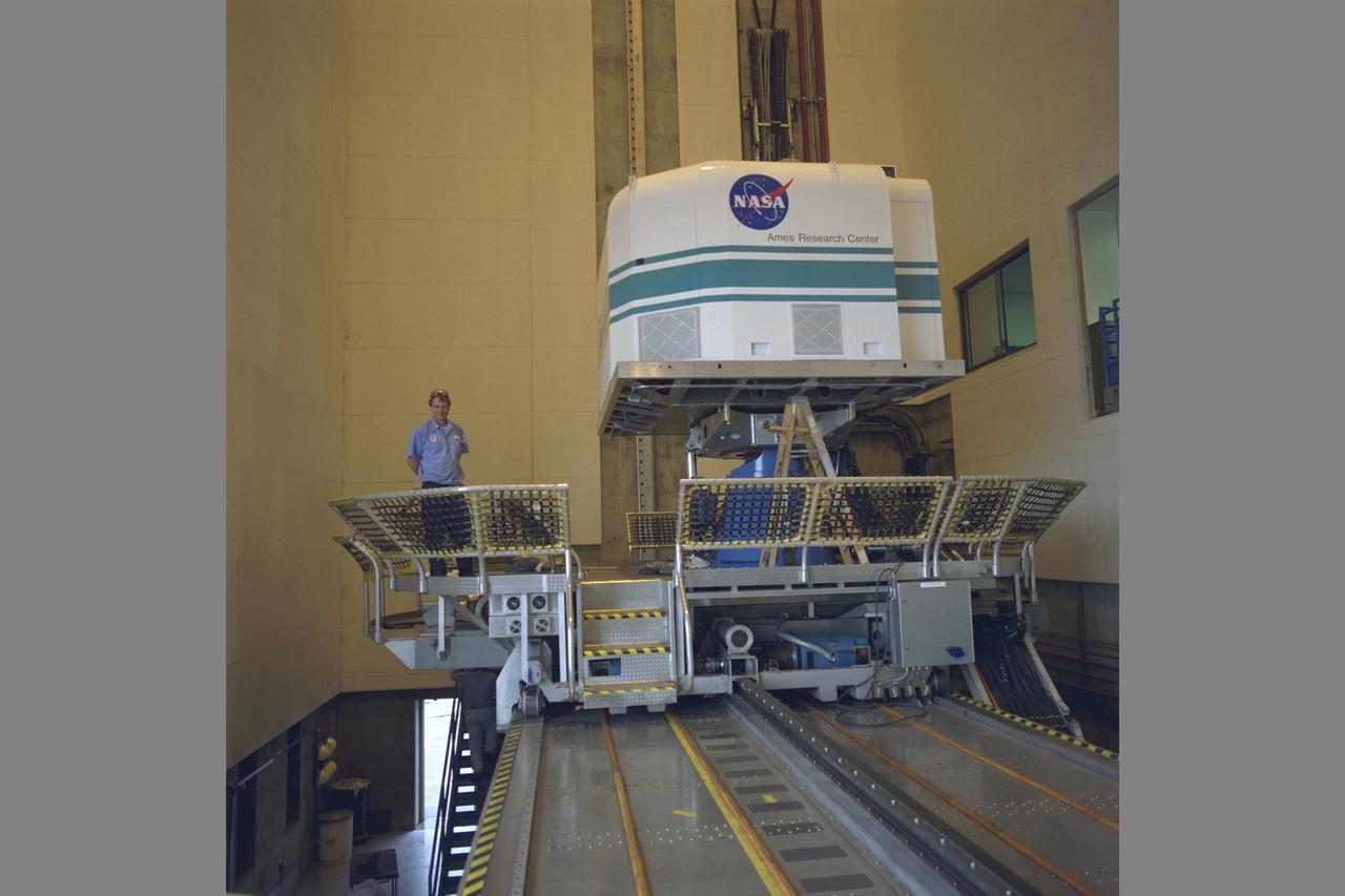 Tiltrotor Aircraft, Transport Aircraft T-Cab moving into NASA Ames Vertical Motion Simulaotor (VMS) from I-Cab Fixed Base Area in bldg. N-243 using trolly.