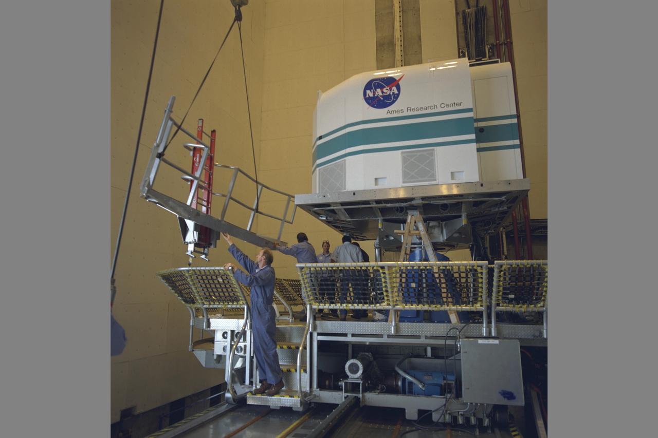Tiltrotor Aircraft, Transport Aircraft T-Cab moving into NASA Ames Vertical Motion Simulaotor (VMS) from I-Cab Fixed Base Area in bldg. N-243 using trolly.