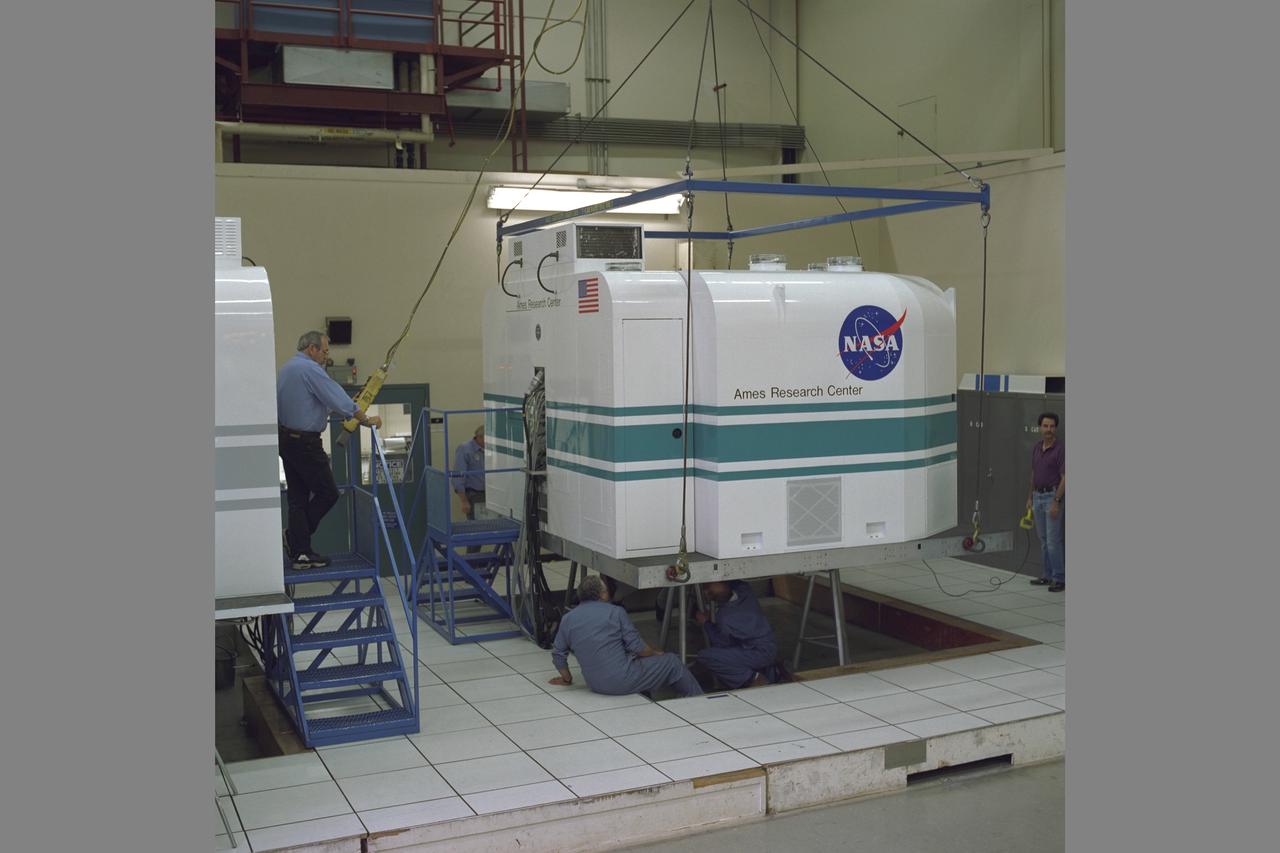 Tiltrotor Aircraft, Transport Aircraft T-Cab moving into NASA Ames Vertical Motion Simulaotor (VMS) from I-Cab Fixed Base Area in bldg. N-243 using trolly.