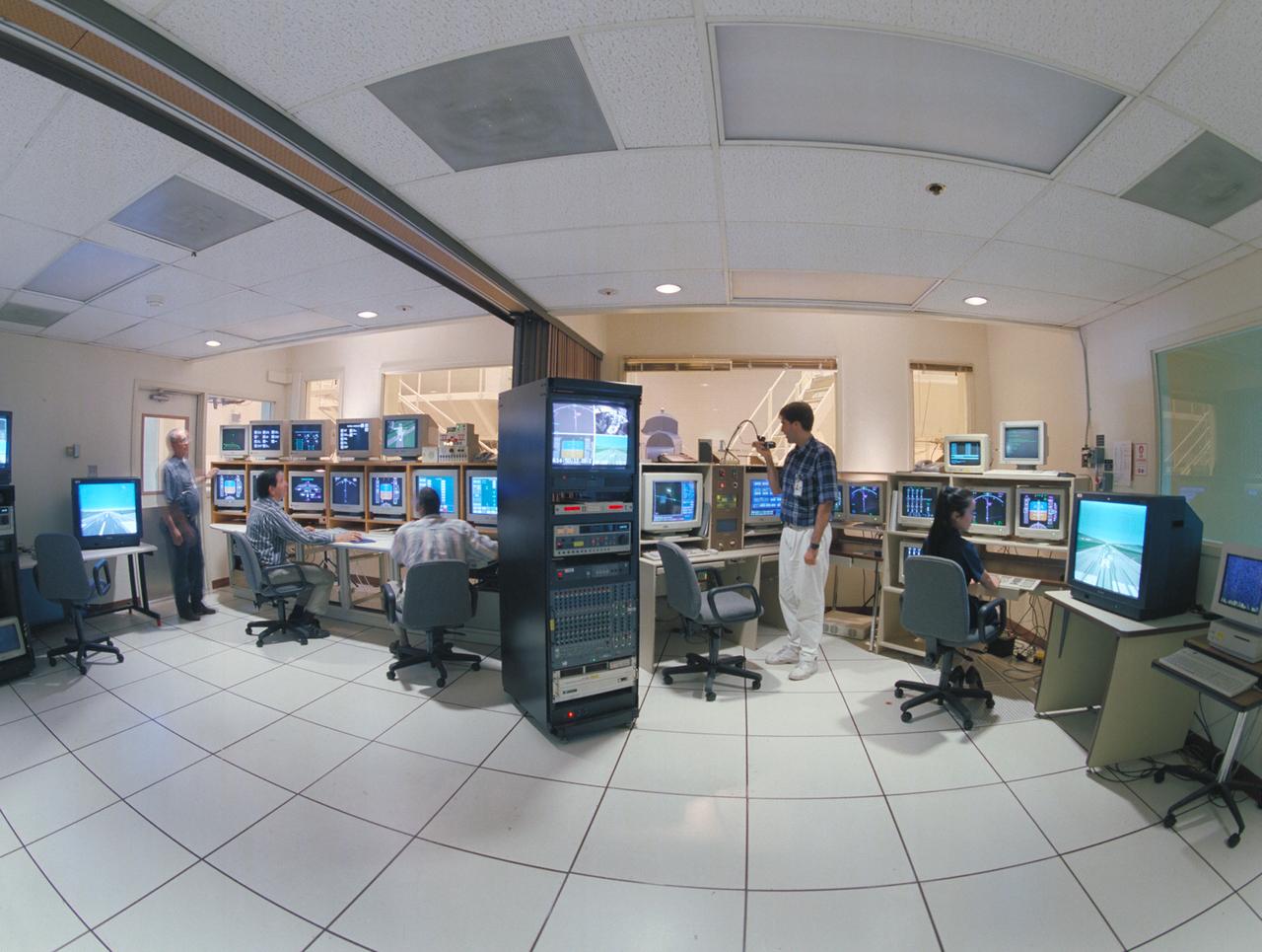 N-257 CVSRF: control rooms for 747 and ACSF cabs - LEFT SIDE; EOS - ACFS (Advanced Cab Flight Simulator) w. (l-r) Victor Loesche, Hector Reyes & Eric Jacobs and RIGHT SIDE; EOS - 747 Cab with (l-r) David Brown and Cindy Nguyen