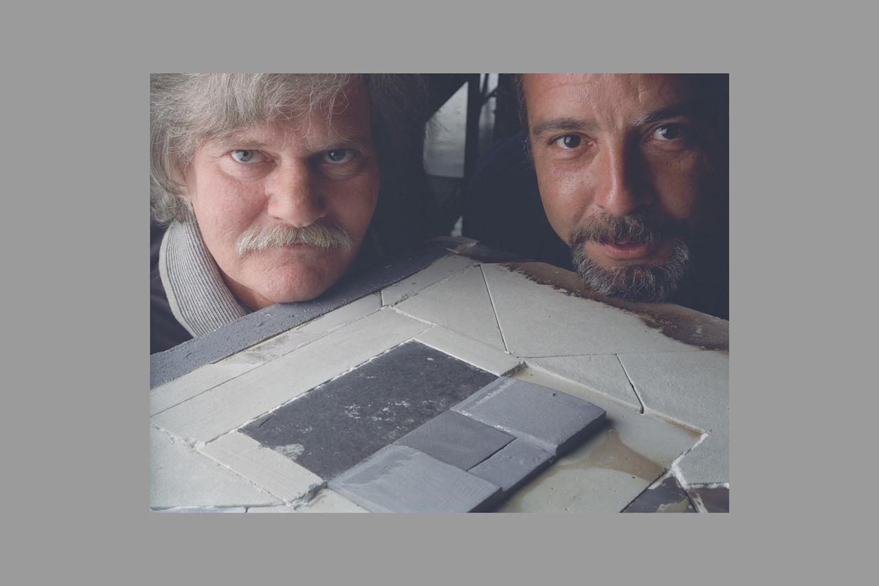 Surface Protected Flexible Insulation (SPFI) Blanket in Panel Test Facililty PTF-78 V. Meglio and D Threoux are shown here with the Ames made calibration model