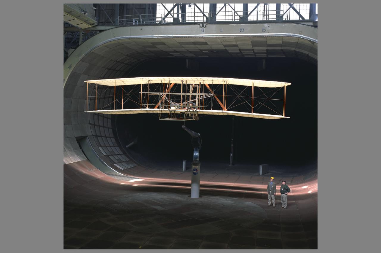 Wright Flyer Replica Test-40-0047:  Ames 40 x 80 foot Subsonic  Wind Tunnel.   View of Installation with Pete Zell (In Cap) and Felton Smith.                   (Testing of the replica for it's airworthiness was as part of the Centennial of Flight celebration.)
