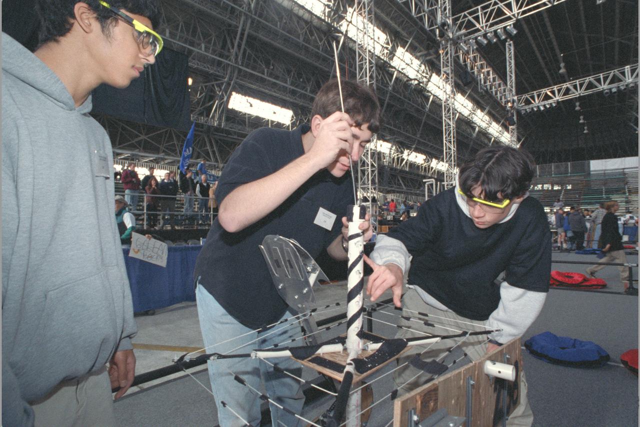NASA AMES sponsored  FIRST (Inspiration and Recognition of Science and Technology) Western Regional Robot Games Student competition in Hangar  Students making repairs between matches
