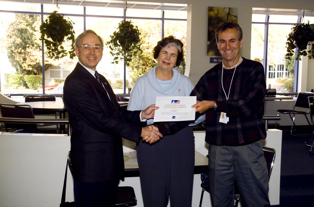 CFC Awards ceremony: William, Ames Deputy Director (L) Grace Ann Weiler, Ames 2001 CFC chairperson (C) and Tom Moyles, Director of Center Operations accepts CFC Inter-Directorate Competition Outstanding Participation plaque .