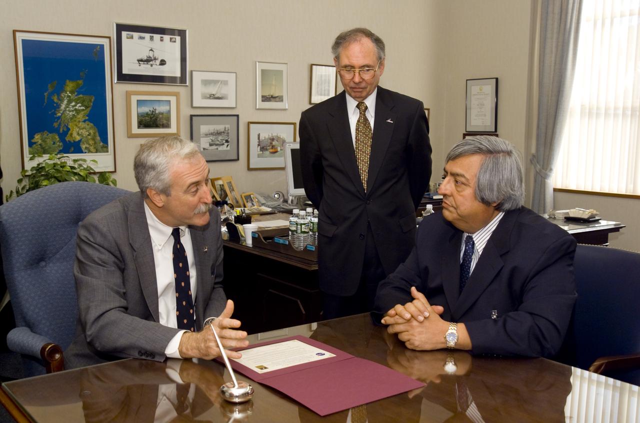 NASA Administrator Sean O'Keefe comes to Ames for employee briefing and tour. Meets with Roberto Cruz, National Hispanic University (seated, right) and Ames Center Director Dr. Henry McDonald follow the signing of the educational MOU between NHU and Ames.