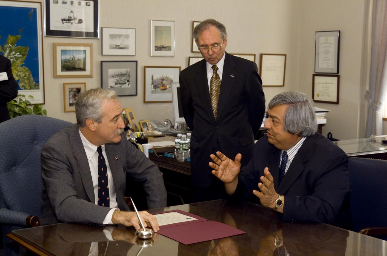 NASA Administrator Sean O'Keefe comes to Ames for employee briefing and tour. Meets with Roberto Cruz, National Hispanic University (seated, right) and Ames Center Director Dr. Henry McDonald follow the signing of the educational MOU between NHU and Ames.