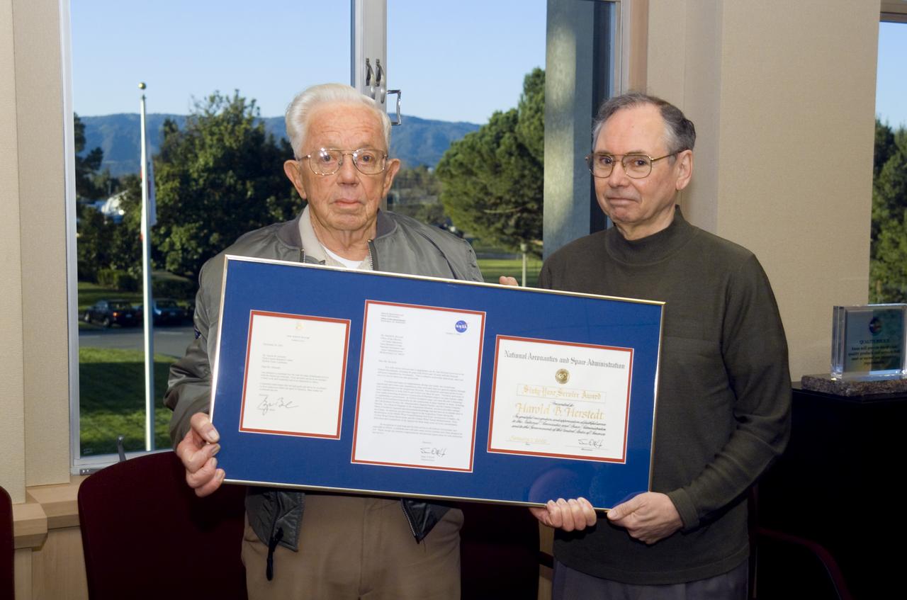 Length of Service Award (LOS) Harold Herstedt with 60 years of service. Award plaque presented by Dr McDonald
