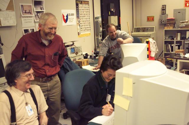 VSHAIP test in 7x10ft#1 W.T. (multiple model configruations) V-22 helicopter shipboard aerodynamic interaction program: L-R seated Allen Wadcox, (standind) Mark Betzina, seated in front of computer Gloria Yamauchi, in background Kurt Long.