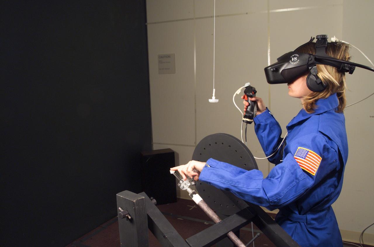 HAPTIC Cueing Research Study (p.i.: Steve Ellis) Virtual environments: Shown is Heather Smith with headgear and controls