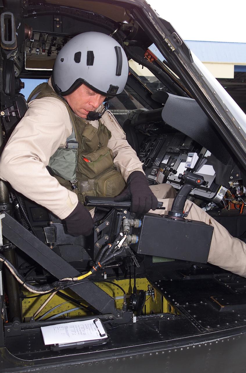 NRTC/RITA Precision Pathway Terminal Guidance: UH-60 RASCAL (#012)  (National Rotocraft Technology Center/Rotorcraft Industry Technology Association) runway independent aircraft - Sikorsky Helicopter pilot Kevin Bredenbeck preparing for flight in RASCAL with Dave Arterburn