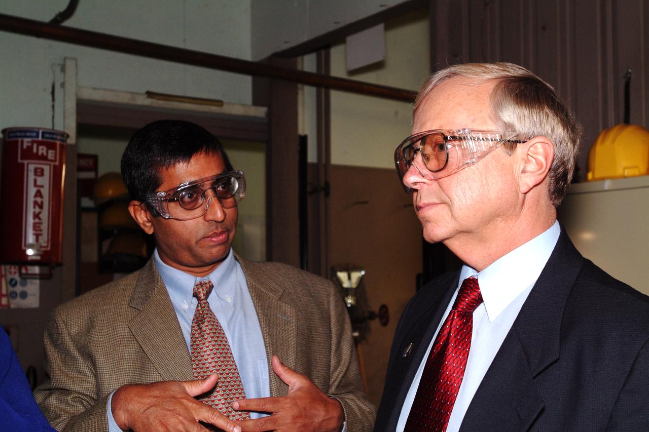 NASA Space Science Advisory Committee Chairman Ed Wiler (r) visit to Ames Research Center: on tour of the Arc Jet Facility with  Ethiraj 'Raj' Venkatapathy   presenting