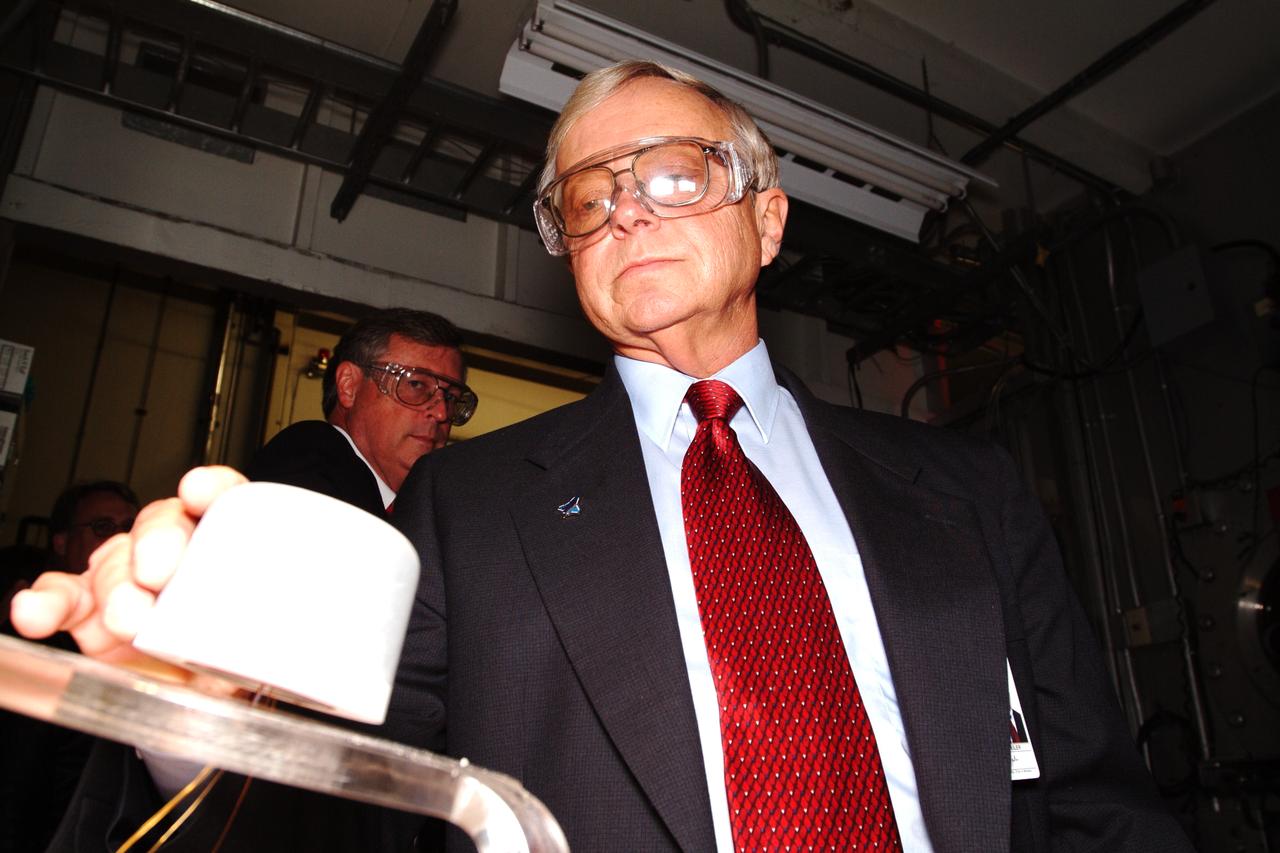 NASA Space Science Advisory Committee Chairman Ed Wiler visit to Ames Research Center: checks out test material while on tour of the Arc Jet Facility
