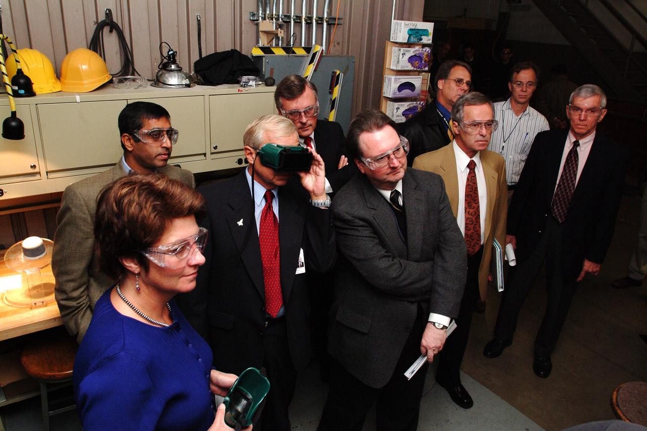 NASA Space Science Advisory Committee Chairman Ed Wiler (r) visit to Ames Research Center: on tour of the Arc Jet Facility with G. Scott Hubbard, Raj Venkatapathy and entourage