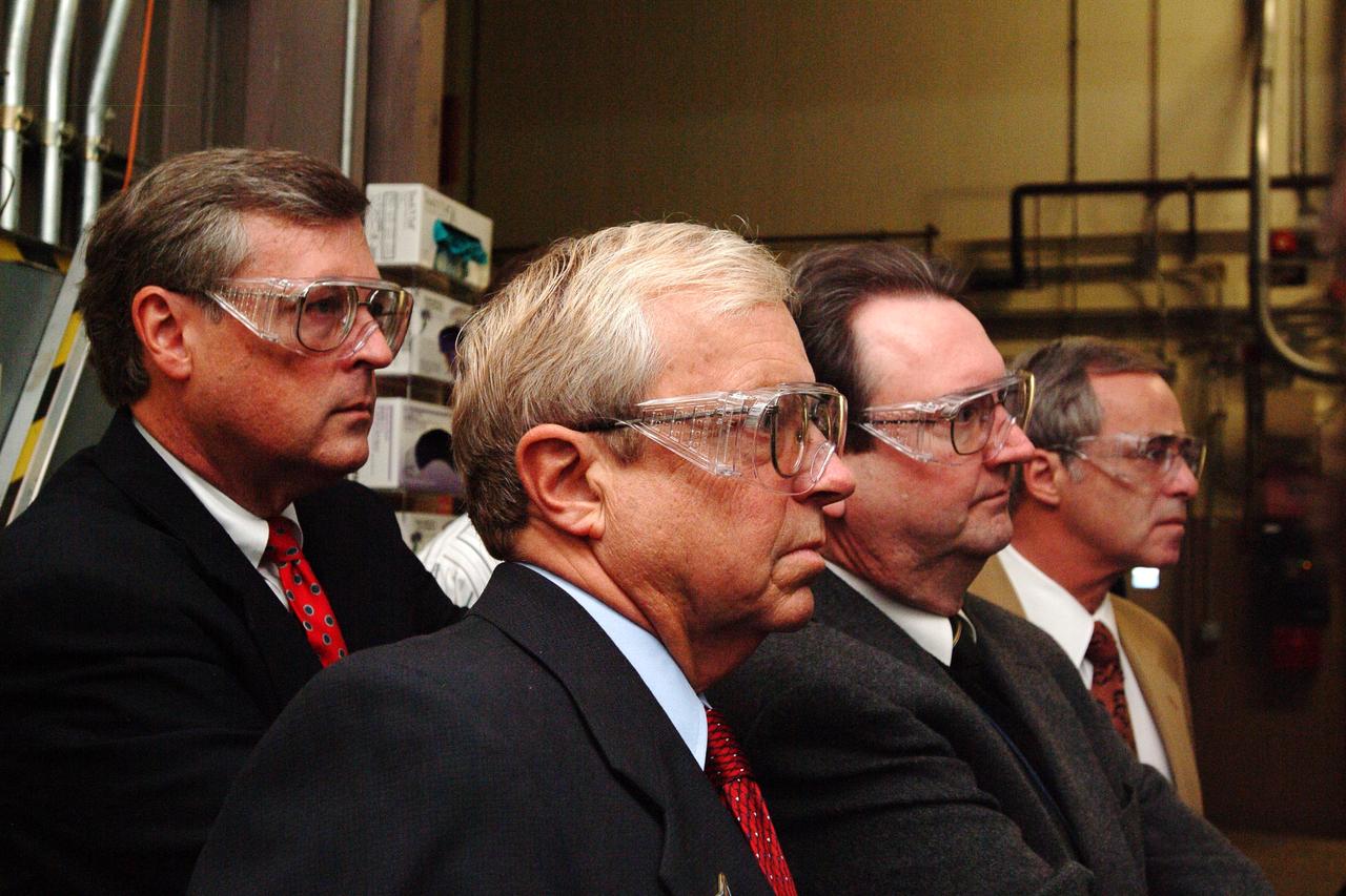 NASA Space Science Advisory Committee Chairman Ed Wiler (r) visit to Ames Research Center: on tour of the Arc Jet Facility with G. Scott Hubbard, Raj Venkatapathy and entourage.