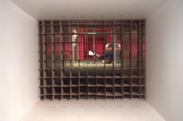 Ames Mars Wind Tunnel Facility N-245: NASA is simulating small martian 'dust devils' and wind in a laboraotry to determine how they may affect the landscape and environment of the red planet. Dust Devils on Mars are often a great deal biggger than those on Earth and can at times cover the whole planet. Martian winds & dust devils, big and little, collectively are a great force that is constantly changing the planet's environment. shown here: looking through Mars W. T. air intake towards test section w/ Eric Eddlemon