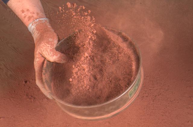 Ames Mars Wind Tunnel Facility N-245: NASA is simulating small martian 'dust devils' and wind in a laboraotry to determine how they may affect the landscape and environment of the red planet. Dust Devils on Mars are often a great deal biggger than those on Earth and can at times cover the whole planet. Martian winds & dust devils, big and little, collectively are a great force that is constantly changing the planet's environment.   shown here: Carbondale Red Clay dust used in vortex generatory and Mars Wind Tunnel